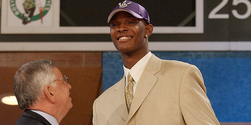 NBA Commissioner David Stern, left, shakes hands with Chris Bosh, of Georgia Tech, after he was chosen as the fourth pick in the first round of the 2003 NBA Draft by the Toronto Raptors Thursday, June 26, 2003 in New York. (AP Photo/Ed Betz)
