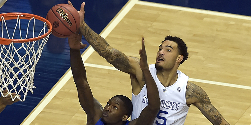 Kentucky forward Willie Cauley-Stein (15) shoots against Florida forward Dorian Finney-Smith (10) during the first half of an NCAA college basketball game in the quarter final round of the Southeastern Conference tournament, Friday, March 13, 2015, in Nashville, Tenn. (AP Photo/Mike Stewart)