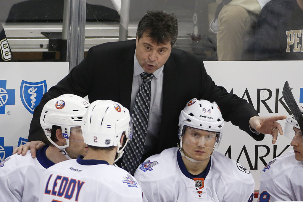 New York Islanders head coach Jack Capuano gives instructions during an NHL hockey game against the Pittsburgh Penguins in Pittsburgh, Tuesday, March 15, 2016. (AP Photo/Gene J. Puskar)