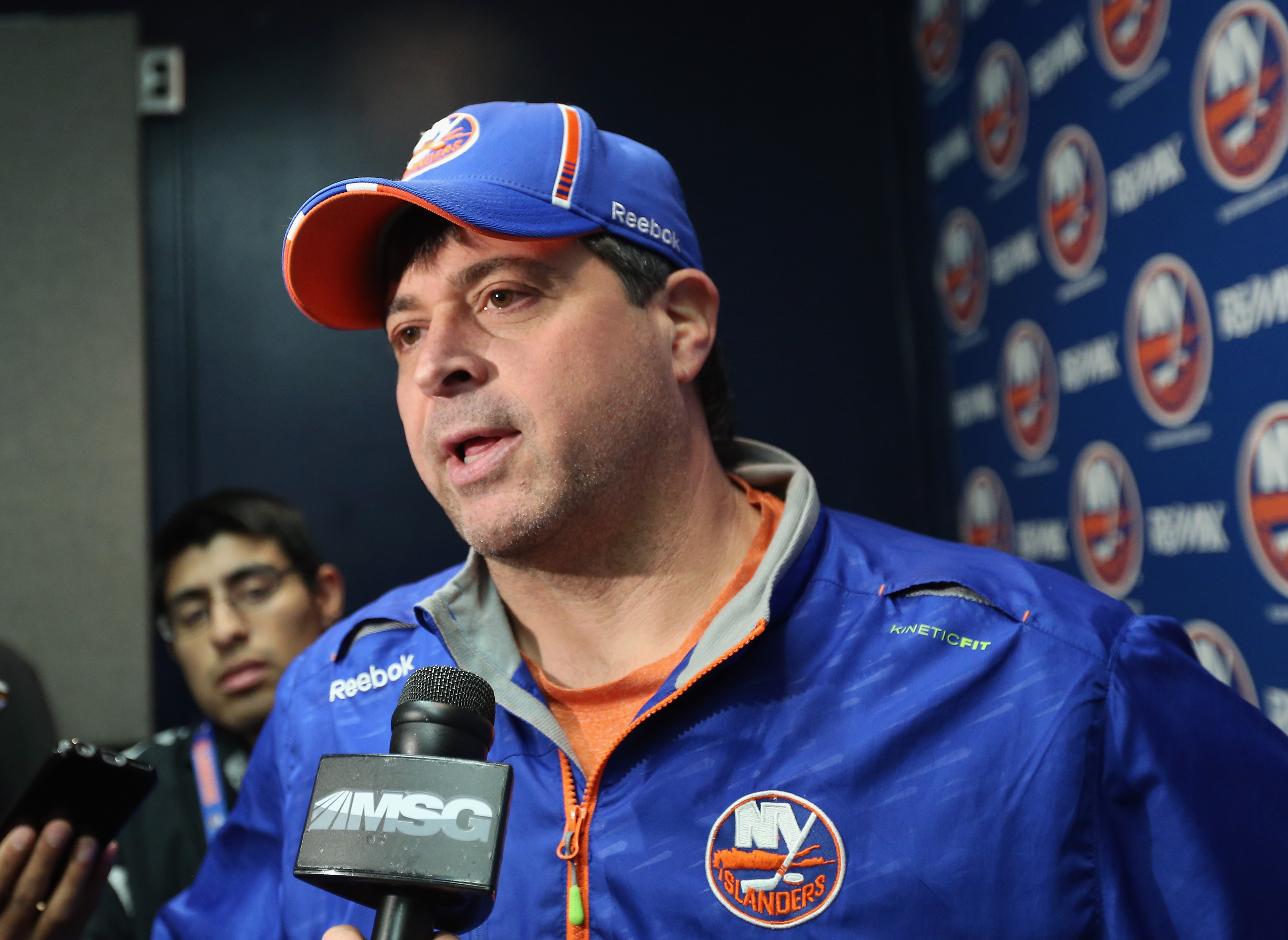 UNIONDALE, NY - MARCH 29: Jack Capuano of the New York Islanders speaks with the media prior to the game against the Detroit Red Wings at the Nassau Veterans Memorial Coliseum on March 29, 2015 in Uniondale, New York. (Photo by Bruce Bennett/Getty Images)