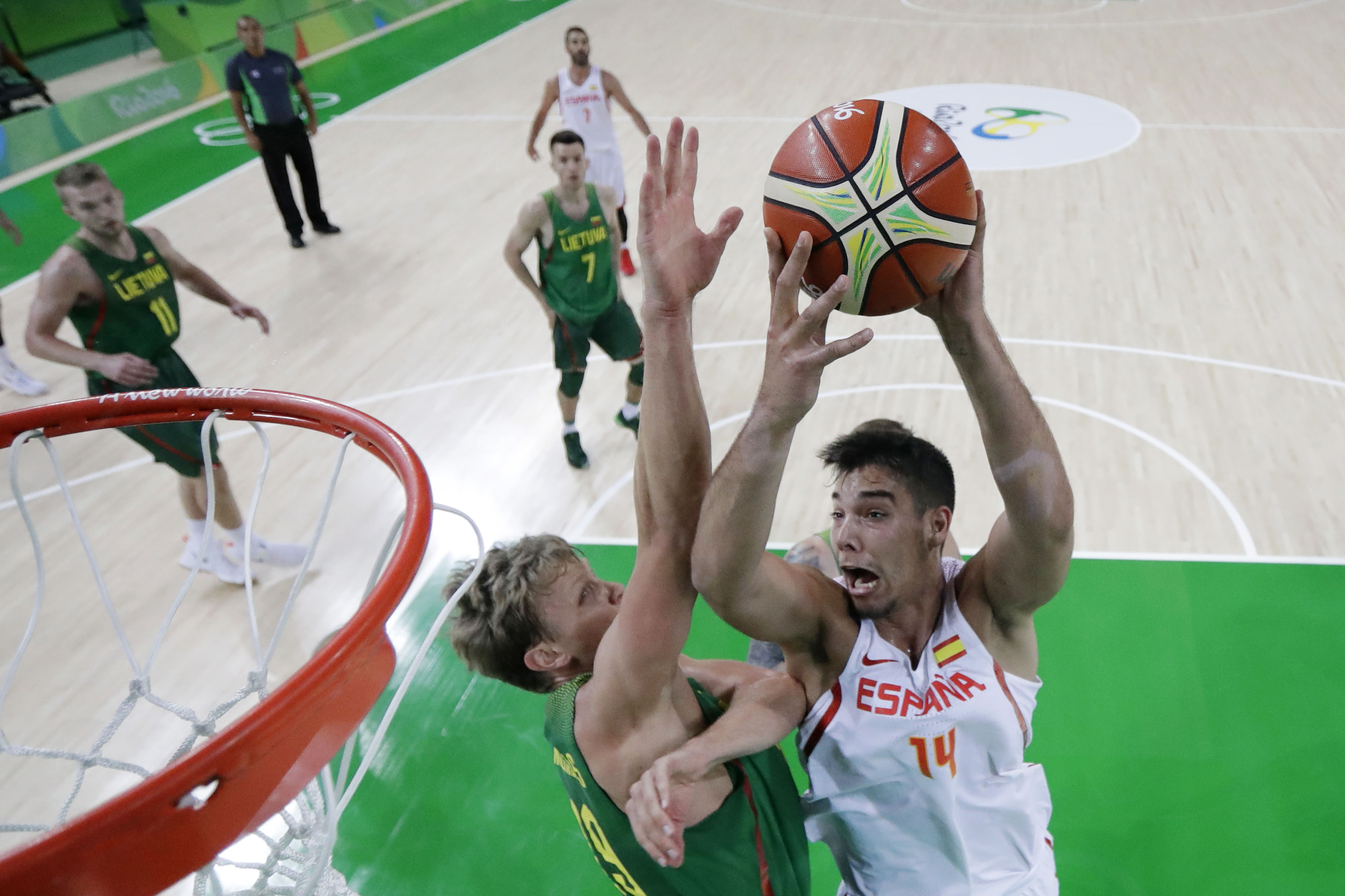 Spain's centre Willy Hernangomez (R) jumps for a basket by Lithuania's small forward Mindaugas Kuzminskas during a Men's round Group B basketball match between Spain and Lithuania at the Carioca Arena 1 in Rio de Janeiro on August 13, 2016 during the Rio 2016 Olympic Games. / AFP / POOL / STR (Photo credit should read STR/AFP/Getty Images)