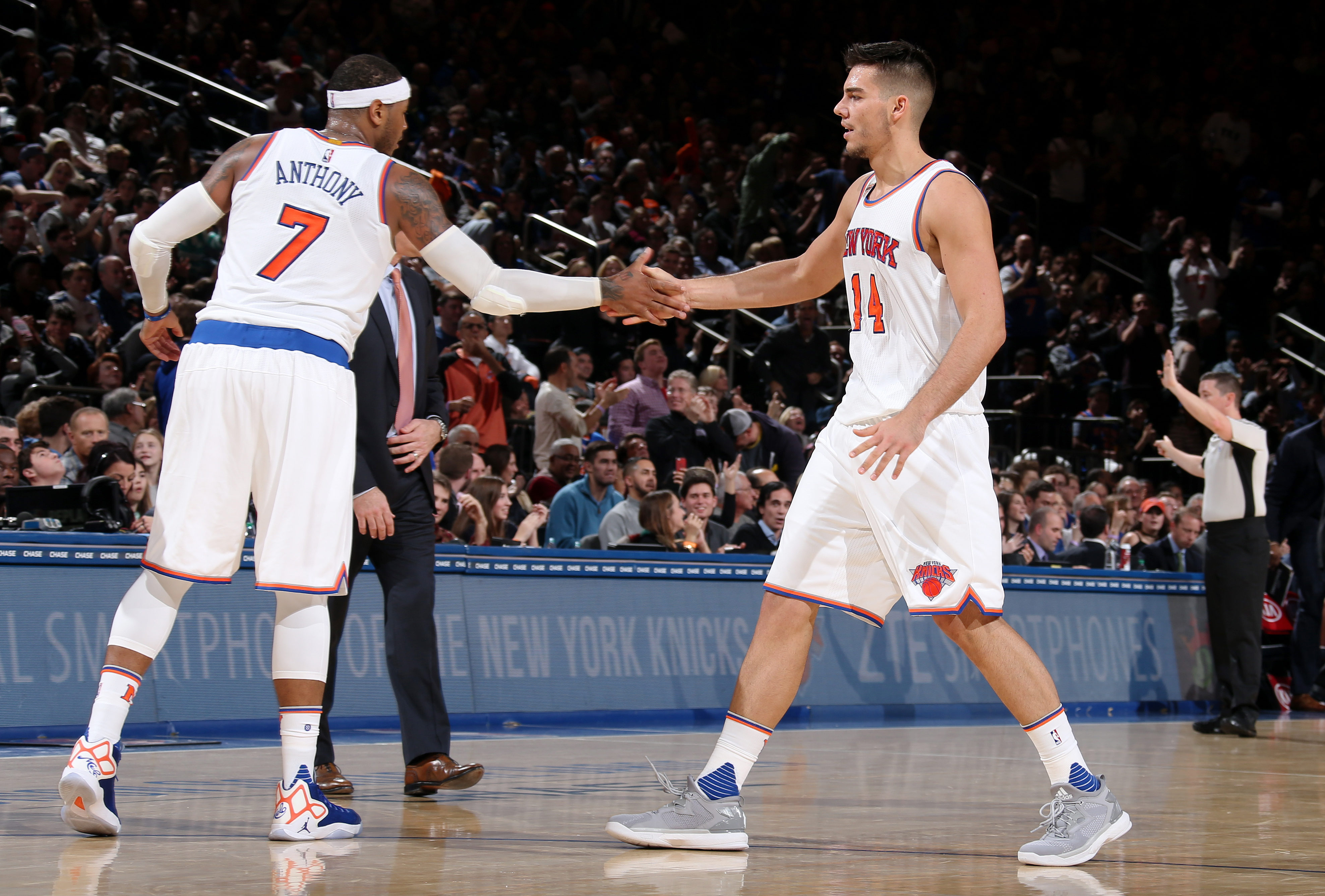 NEW YORK CITY - NOVEMBER 25: Carmelo Anthony #7 and Willy Hernangomez #14 of the New York Knicks high five during the game against the Charlotte Hornets at Madison Square Garden in New York, New York. NOTE TO USER: User expressly acknowledges and agrees that, by downloading and/or using this Photograph, user is consenting to the terms and conditions of the Getty Images License Agreement. Mandatory Copyright Notice: Copyright 2016 NBAE (Photo by Nathaniel S. Butler/NBAE via Getty Images)