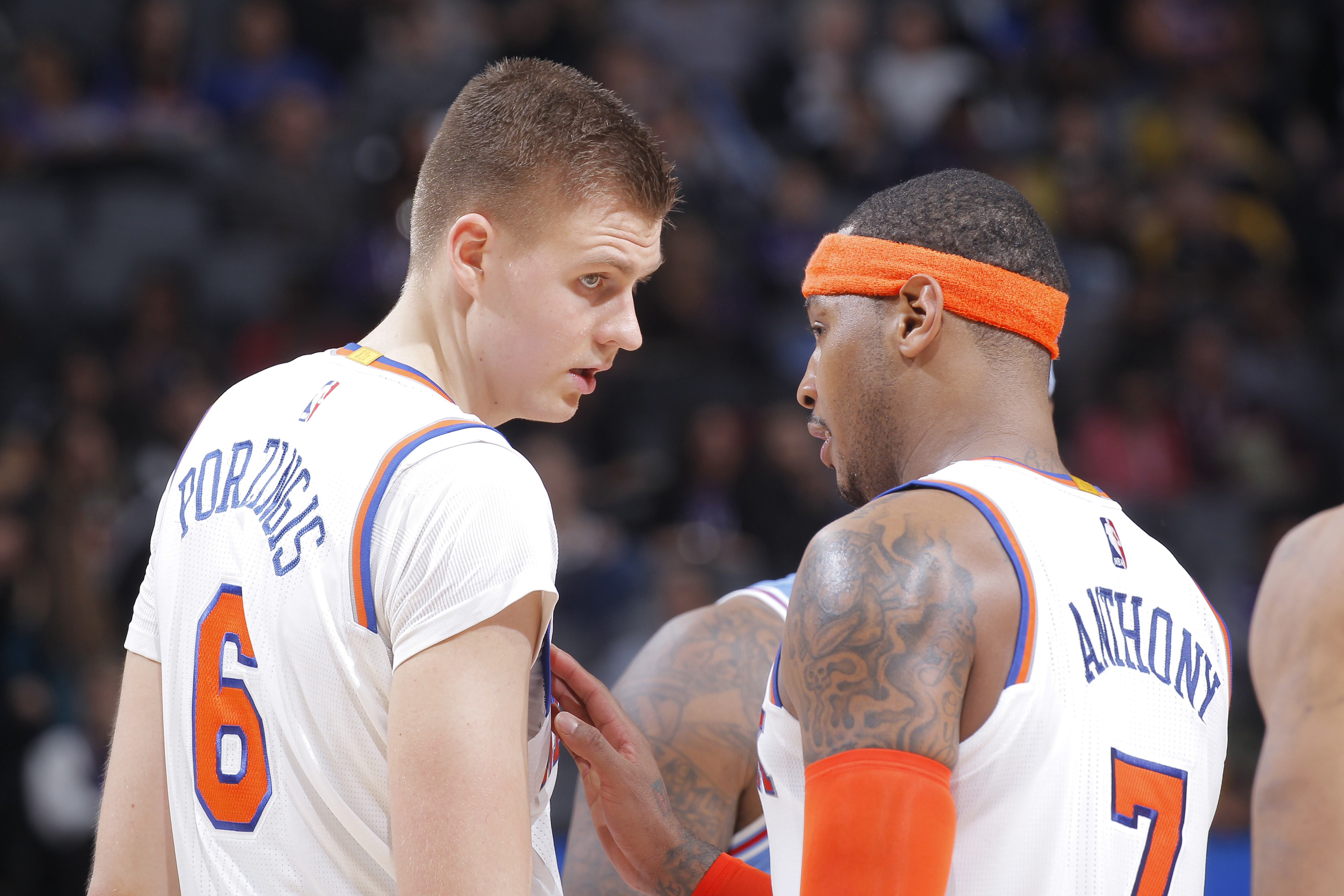 SACRAMENTO, CA - DECEMBER 9: Kristaps Porzingis #6 and Carmelo Anthony #7 of the New York Knicks talk during the game against the Sacramento Kings on December 9, 2016 at Golden 1 Center in Sacramento, California. NOTE TO USER: User expressly acknowledges and agrees that, by downloading and or using this photograph, User is consenting to the terms and conditions of the Getty Images Agreement. Mandatory Copyright Notice: Copyright 2016 NBAE (Photo by Rocky Widner/NBAE via Getty Images)