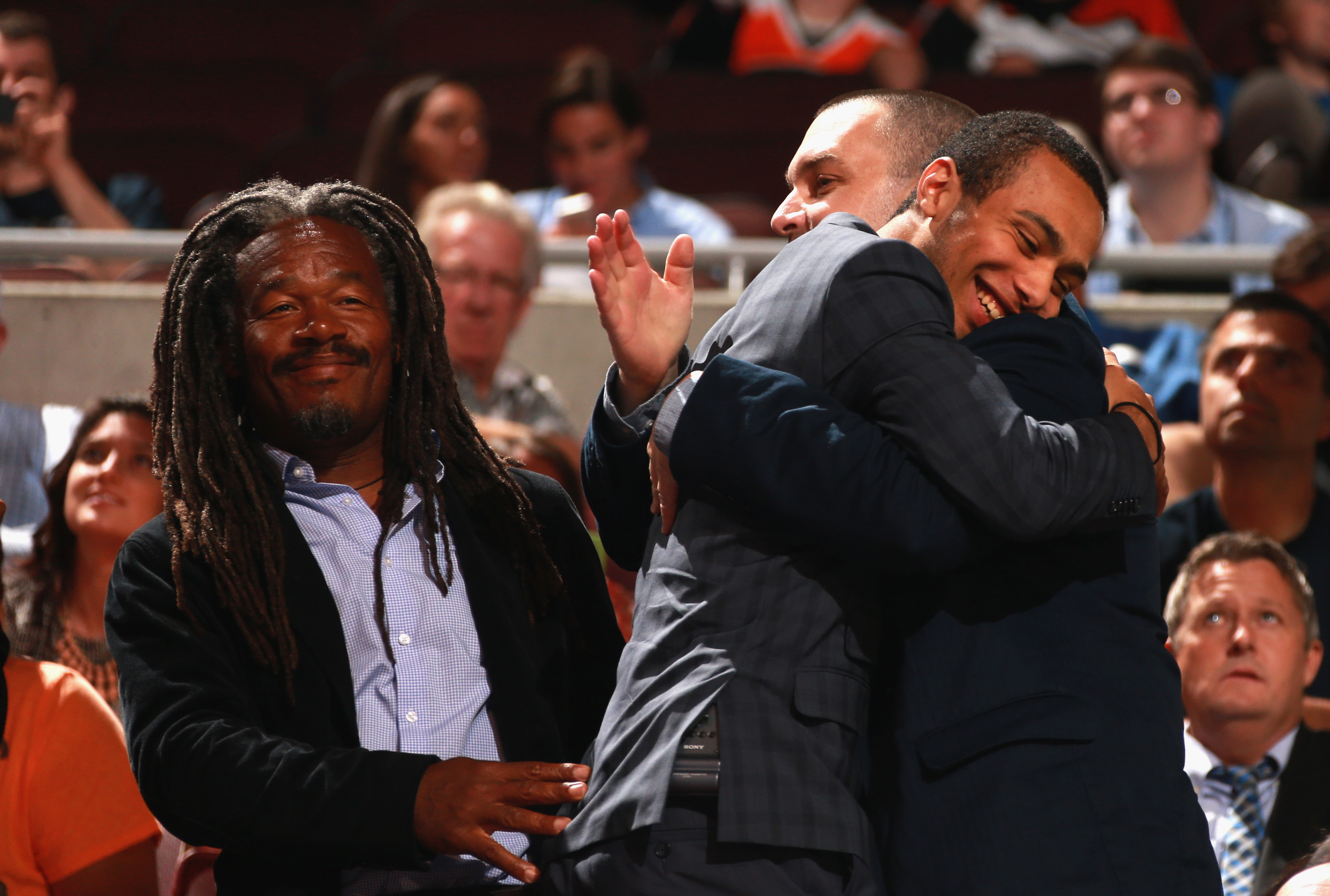 PHILADELPHIA, PA - JUNE 27: Josh Ho-Sang celebrates with his dad (L) and a family friend after being selected 28th overall by the New York Islanders during the 2014 NHL Entry Draft at Wells Fargo Center on June 27, 2014 in Philadelphia, Pennsylvania. (Photo by Dave Sandford/NHLI via Getty Images)