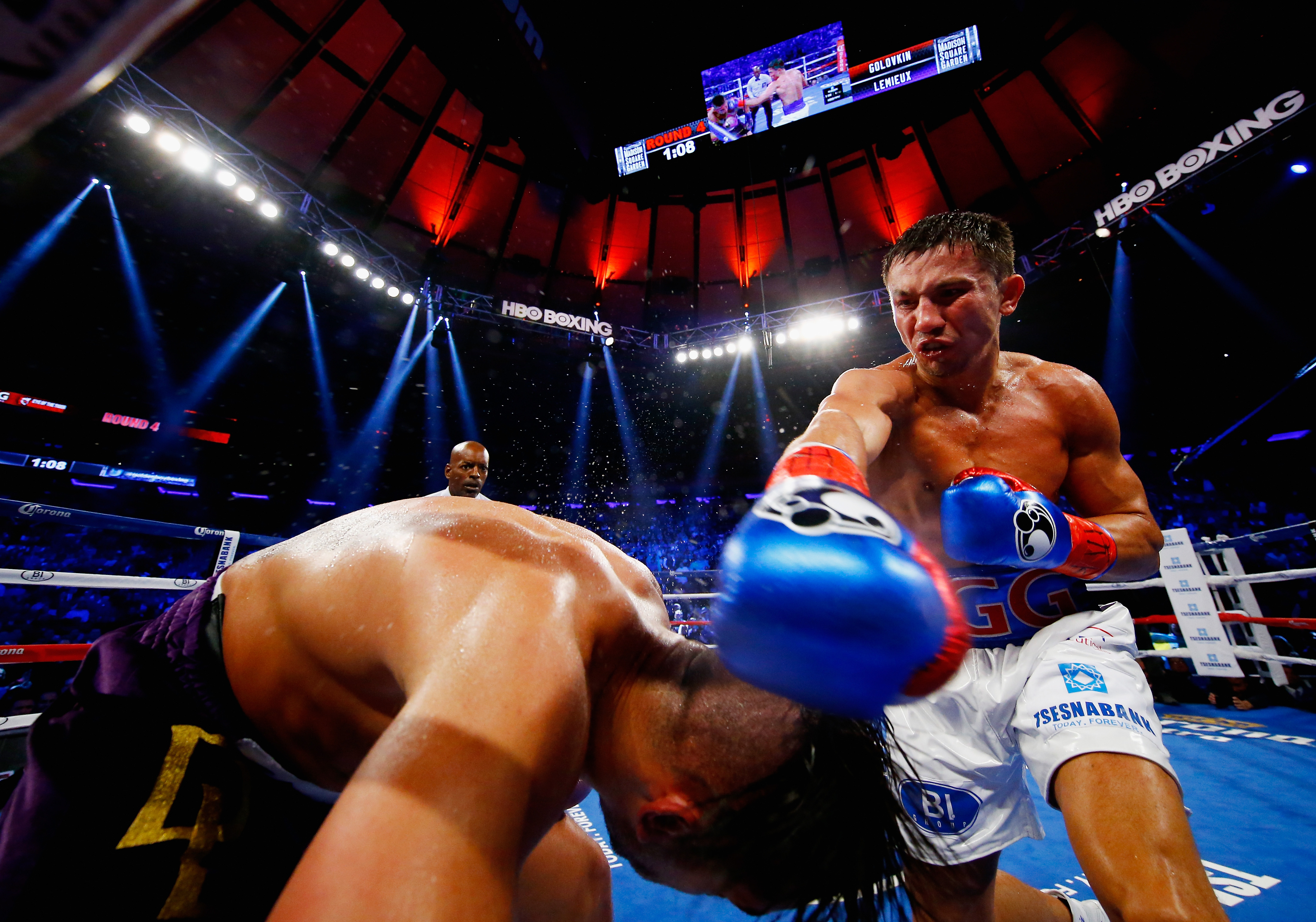 NEW YORK, NY - OCTOBER 17: Gennady Golovkin punches David Lemieux during their WBA/WBC interim/IBF middleweight title unification bout at Madison Square Garden on October 17, 2015 in New York City. (Photo by Al Bello/Getty Images)