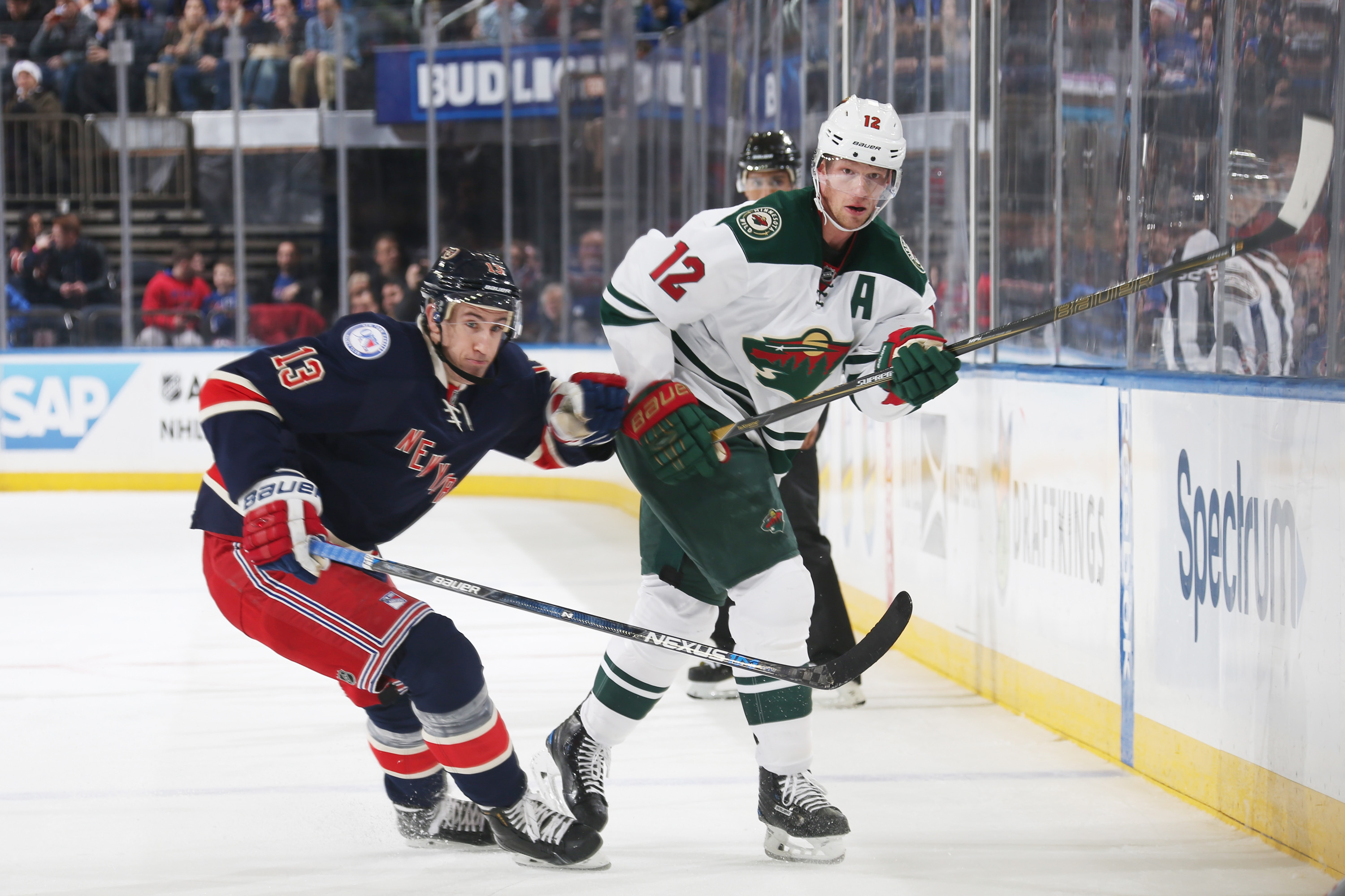 NEW YORK, NY - DECEMBER 23: Eric Staal #12 of the Minnesota Wild skates against Kevin Hayes #13 of the New York Rangers at Madison Square Garden on December 23, 2016 in New York City. The Minnesota Wild won 7-4. (Photo by Jared Silber/NHLI via Getty Images)