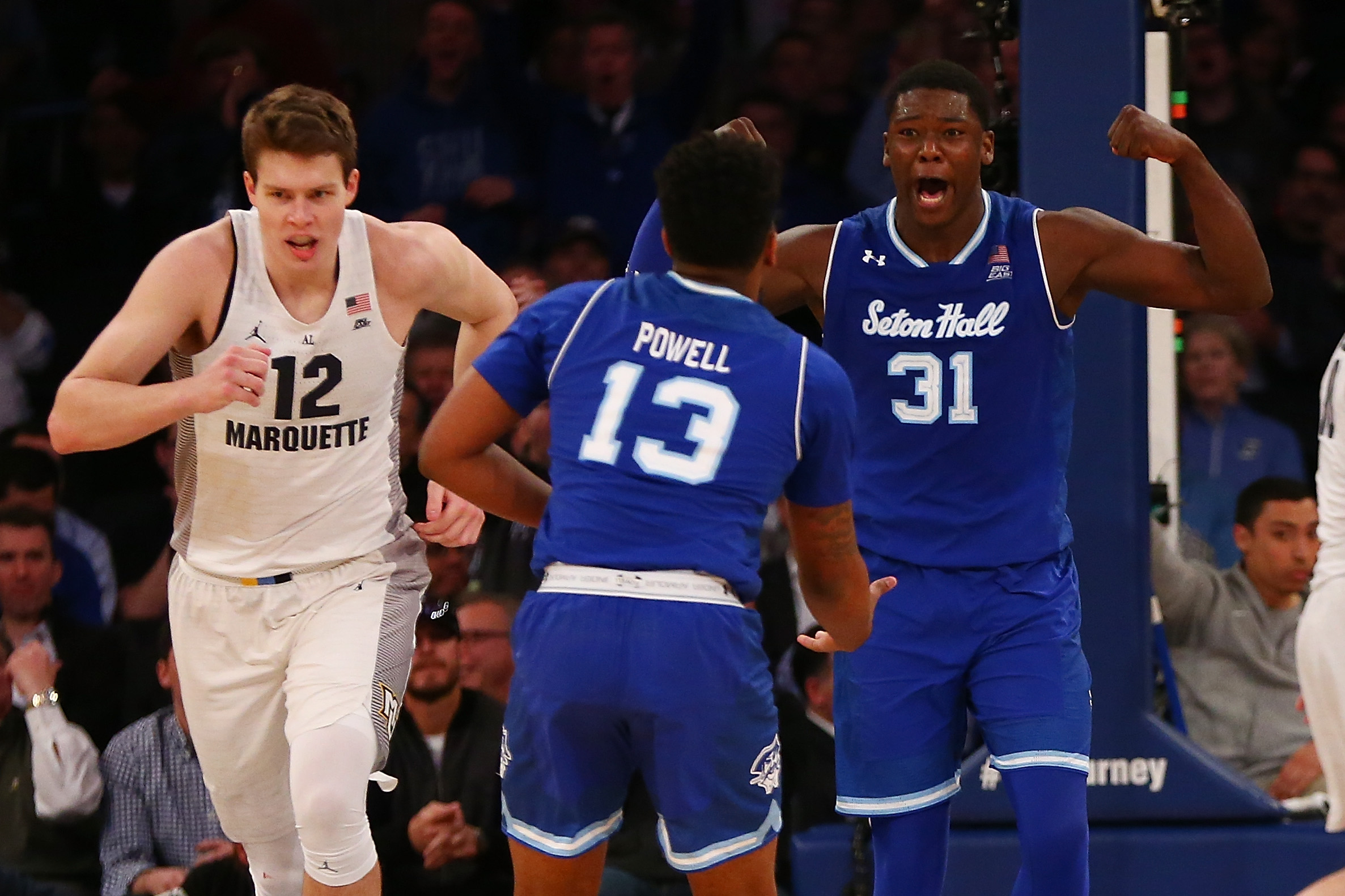 NEW YORK, NY - MARCH 09: Angel Delgado #31 of the Seton Hall Pirates celebrates after dunking the ball with teammate Myles Powell #13 against the Marquette Golden Eagles during the Big East Basketball Tournament - Quarterfinals at Madison Square Garden on March 9, 2017 in New York City. (Photo by Mike Stobe/Getty Images)