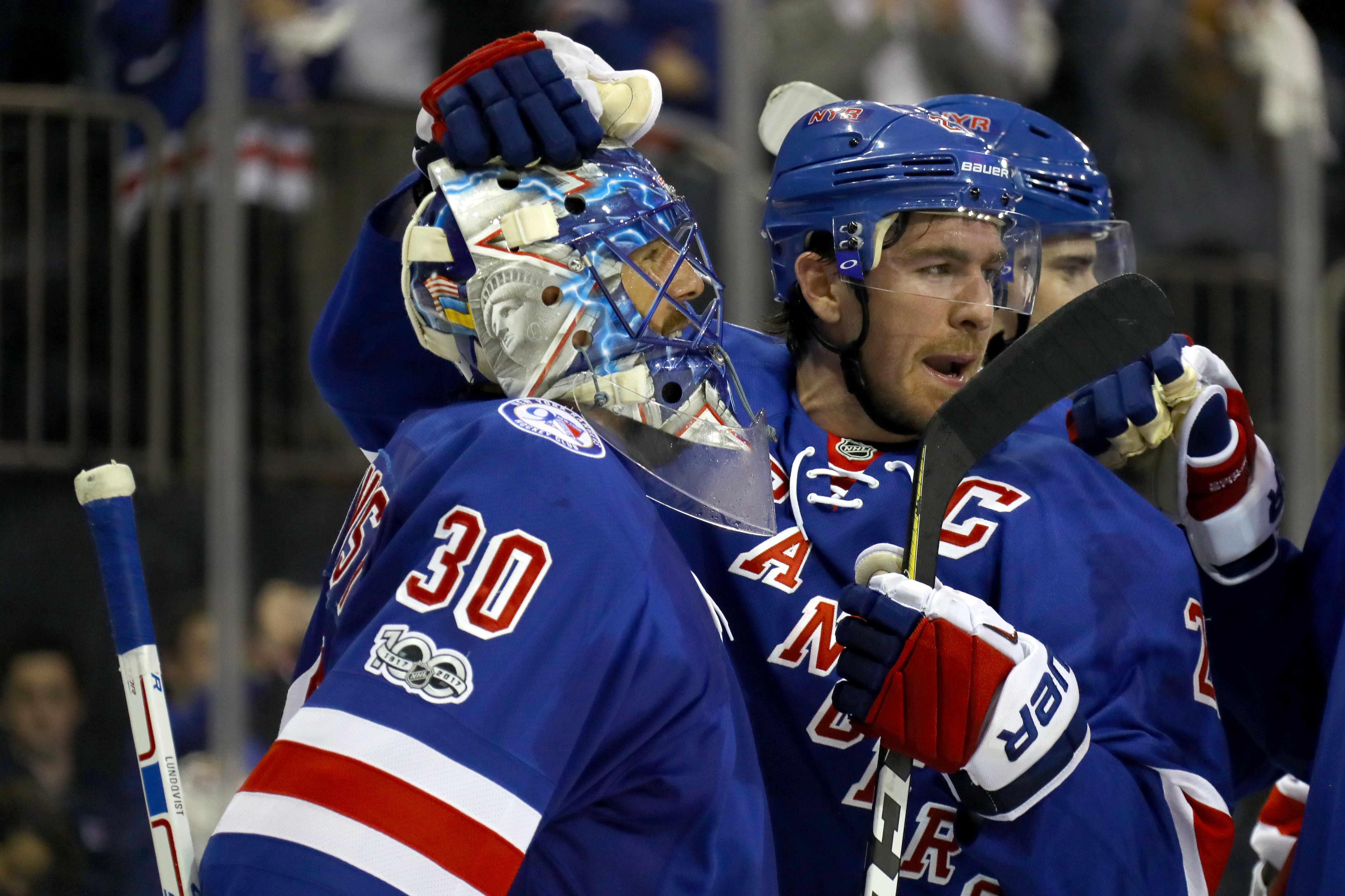 NEW YORK, NY - APRIL 22:  Henrik Lundqvist #30 of the New York Rangers celebrates with teammate Ryan McDonagh #27 after defeating the Montreal Canadiens in Game Six of the Eastern Conference to win the First Round with a score of 3 to 1 during the 2017 NHL Stanley Cup Playoffs at Madison Square Garden on April 22, 2017 in New York City.  (Photo by Bruce Bennett/Getty Images)