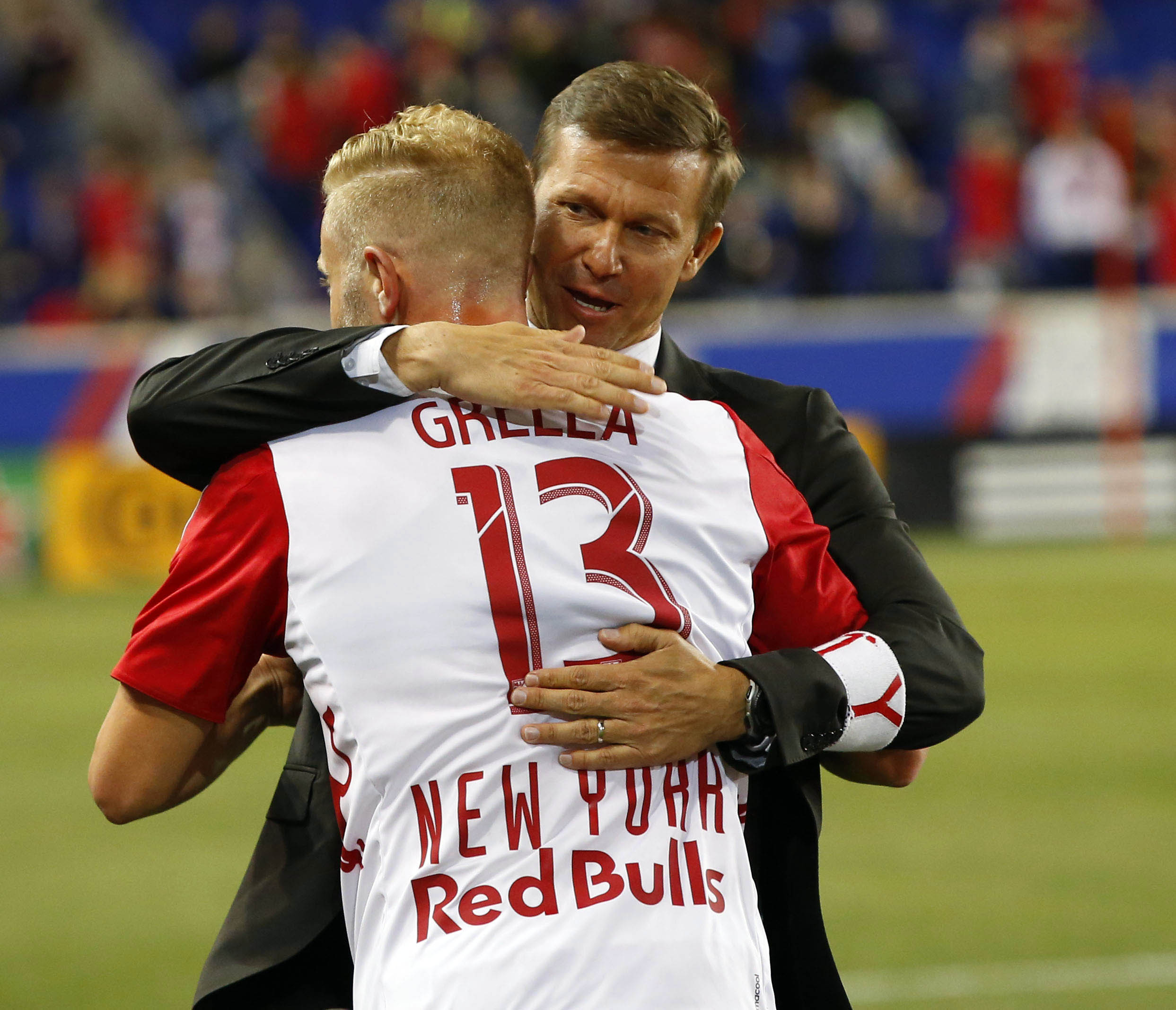 May 18, 2016; Harrison, NJ, USA; New York Red Bulls head coach Jesse Marsch congratulates New York Red Bulls forward Mike Grella (13) after scoring goal against Chicago Fire during second half at Red Bull Arena. The New York Red Bulls defeated Chicago Fire 1-0. Mandatory Credit: Noah K. Murray-USA TODAY Sports