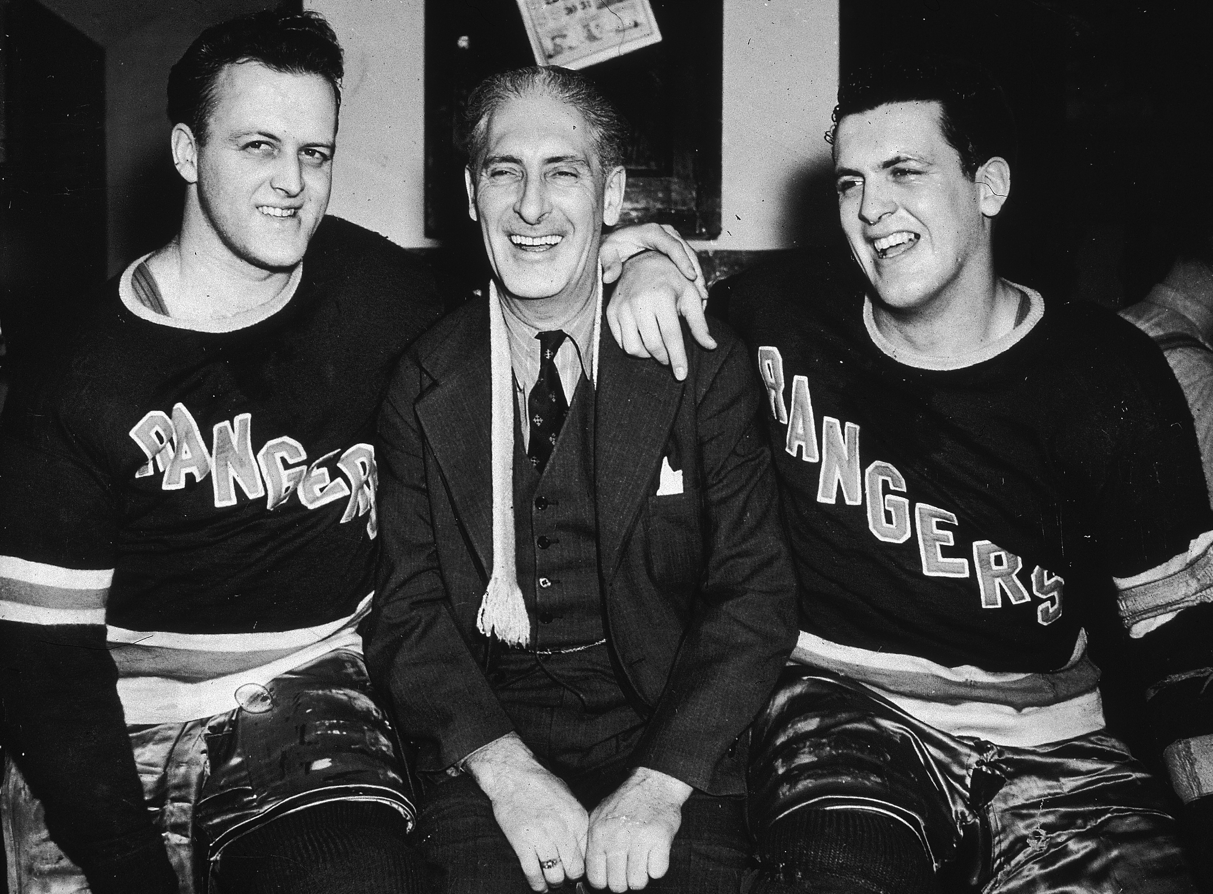 Circa 1940, New York Rangers hockey team manager Lester Patrick posing with his sons, Rangers players Lynn, left, and Muzz. (Photo by New York Times Co./Getty Images)