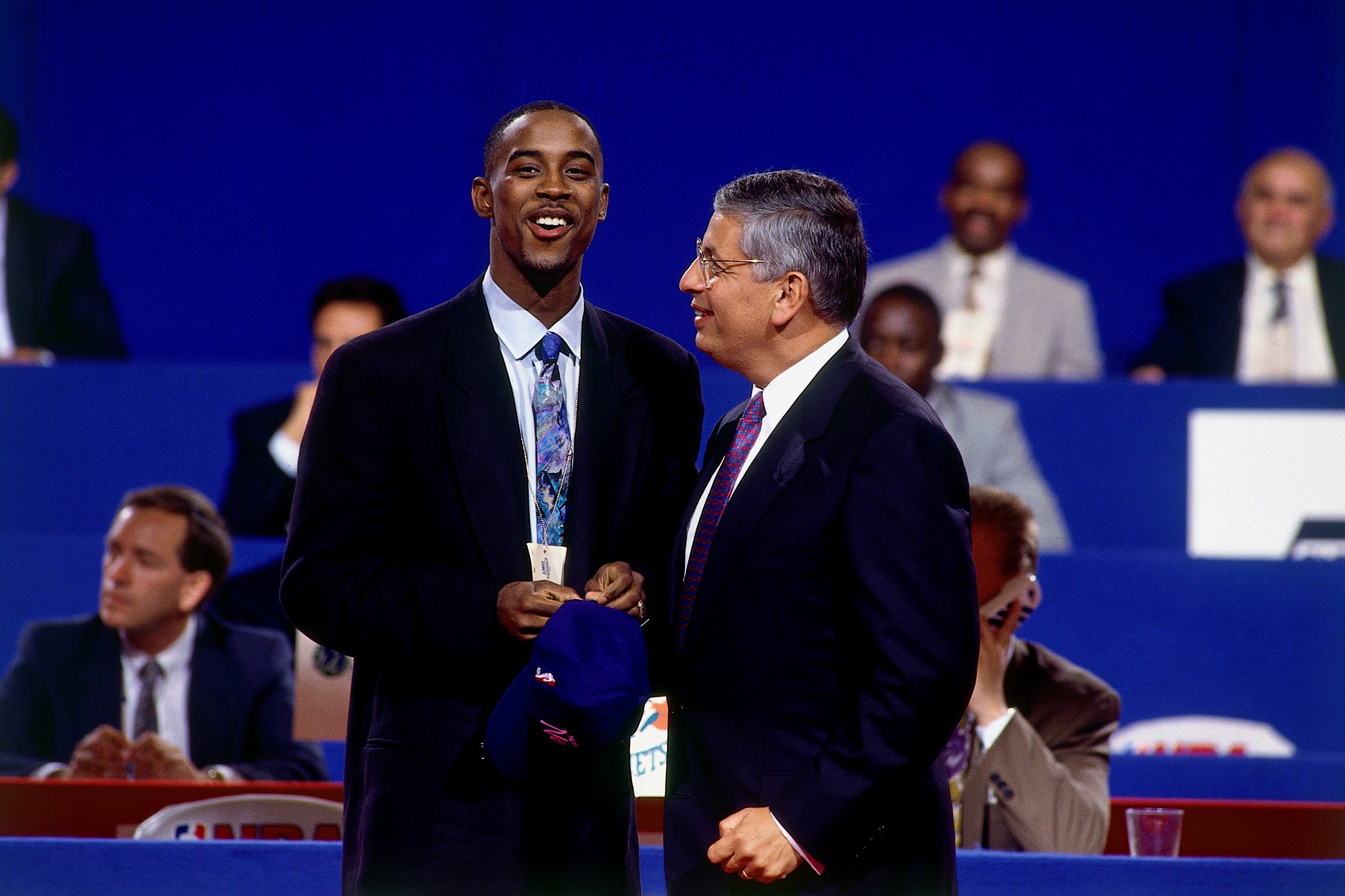 NEW YORK - JUNE 26: Kenny Anderson shakes hands with NBA Commissioner David Stern after he was selected number two overall by the New Jersey Nets during the 1991 NBA Draft on June 26, 1991 at Madison Square Garden in New York, New York. NOTE TO USER: User expressly acknowledges that, by downloading and or using this photograph, User is consenting to the terms and conditions of the Getty Images License agreement. Mandatory Copyright Notice: Copyright 1996 NBAE (Photo by Nathaniel S. Butler/NBAE via Getty Images)